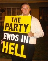 A fanatic holding a sign.